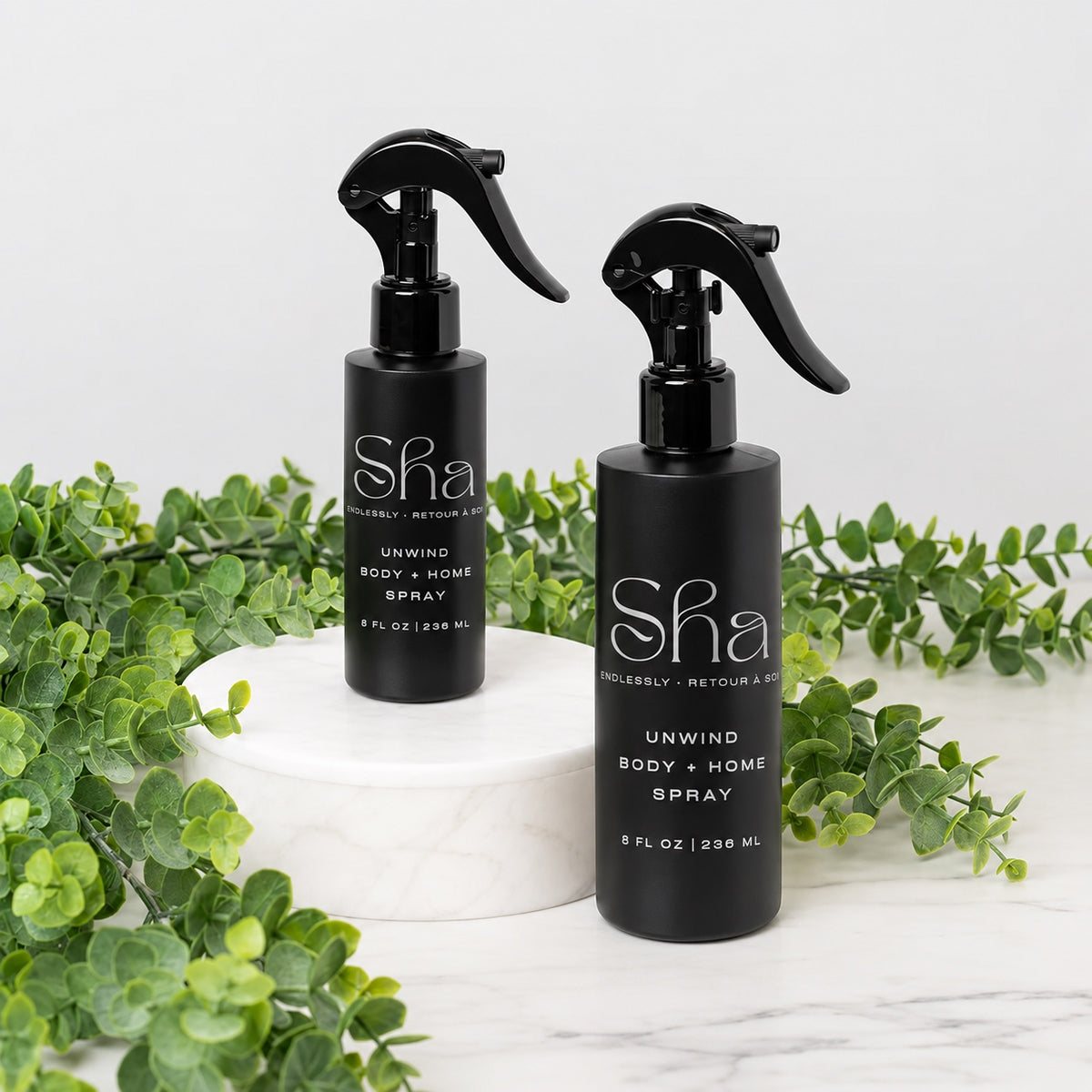 SHA Unwind body and home spray in black bottles